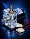 Transparent Rigloop liquid cooling pump with polished metal fittings and visible impeller, standing on a reflective dark blue surface illuminated by electric blue light effects.