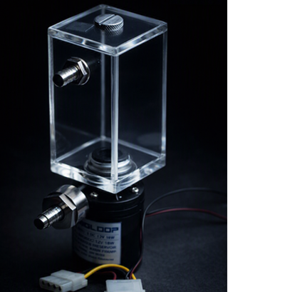A computer liquid cooling pump and reservoir assembly illuminated by cool bluish‑white light against a dark background. The transparent acrylic reservoir with metal fittings sits atop a black cylindrical pump labeled “RIGLOOP DC 12V 18W.” Power cables and connectors extend from the pump, resting on a dark surface